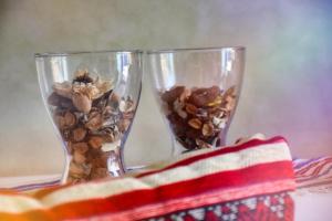 two glass vases filled with dried flowers and an american flag at Route de Miel in Agadir +170 photos