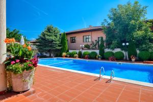 een zwembad voor een huis bij Alekta Hotel - Free parking in Varna