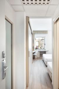 Postel nebo postele na pokoji v ubytování Hotel Carlo Felice Sassari