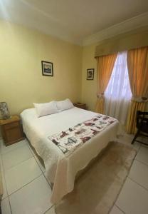 Кровать или кровати в номере Hotel Palermo Quintero