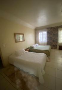 Кровать или кровати в номере Hotel Palermo Quintero