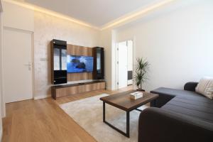 a living room with a couch and a table at MAGIC Apartments in Sarajevo