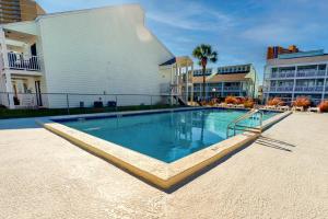 a large swimming pool in front of a building at Southwind C-2 in Panama City Beach