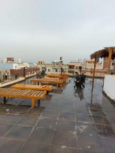 a row of wooden benches sitting on top of a roof at The LOTUS in Hurghada