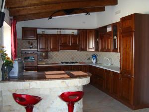 A kitchen or kitchenette at Oasi del Sud Monolocale Stefy