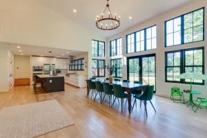 a kitchen and dining room with a table and chairs at Bright Bluemont Home with On-Site Pond and Mtn Views! in Paris