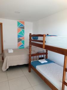 a room with two bunk beds in it at Le Bon Vivant, Nosso Lar in Arraial do Cabo +46 photos