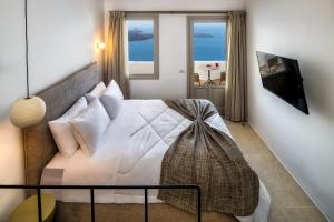 Rúm í herbergi á Ira Hotel & Spa - Adults Only