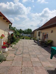 a patio with a hose attached to a house at Raj in Bela Crkva