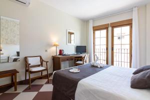 Postel nebo postele na pokoji v ubytování Hotel Avenida Tropical by Bossh! Hotels