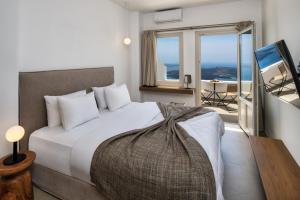 Rúm í herbergi á Ira Hotel & Spa - Adults Only