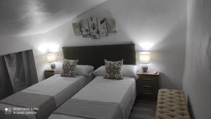 מיטה או מיטות בחדר ב-Casa Mejías, excelente localización, cerca de los principales puntos turísticos de Antequera
