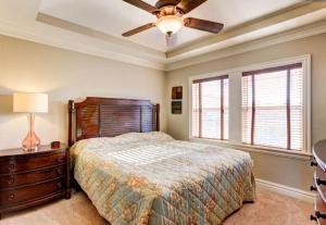 a bedroom with a bed and a ceiling fan at CSC4I - The Platinum Suite in Kill Devil Hills +41 photos