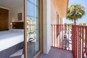 Postel nebo postele na pokoji v ubytování Hotel Avenida Tropical by Bossh! Hotels