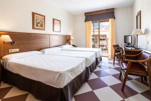 Postel nebo postele na pokoji v ubytování Hotel Avenida Tropical by Bossh! Hotels