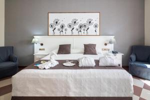 Postel nebo postele na pokoji v ubytování Hotel Avenida Tropical by Bossh! Hotels