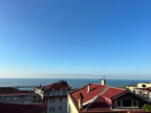 a view of the ocean from the roofs of buildings at Hypatia Apt in Trabzon