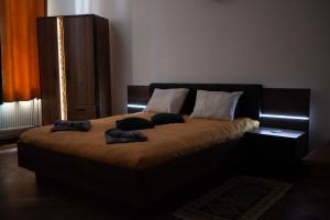 Łóżko lub łóżka w pokoju w obiekcie Bailey Apartment