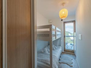 a bedroom with a bunk bed and a bunk bed at Appartement Courchevel 1650, 3 pièces, 6 personnes - FR-1-563-127 in Courchevel