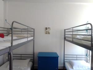 Postel nebo postele na pokoji v ubytování Old Évora Hostel