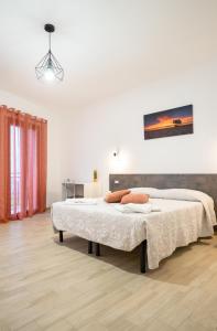 a bedroom with two beds in a room at Da Riccardo in Jerzu