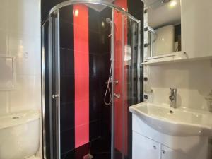 a bathroom with a shower and a toilet and a sink at PARADISO 607 Large Luxury Apartment in Nesebar