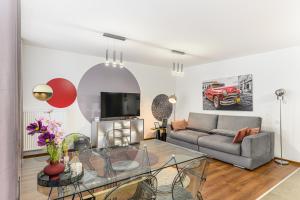 a living room with a couch and a table at Balance Apartments Complex Qualis Brasov in Braşov
