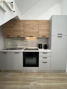 a kitchen with a sink and a stove at Sciantusa in Avola