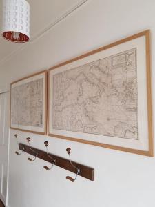 a map hanging on a wall in a room at L'APPART de 75 m², déco sympa à Tours in Tours