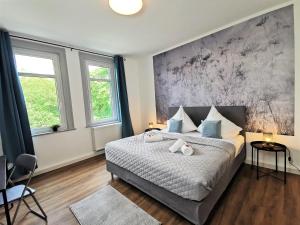 מיטה או מיטות בחדר ב-BohnApartments Deluxe-Zechen-House-Family - 2 Balkone - gratis Parkplätze - WLAN