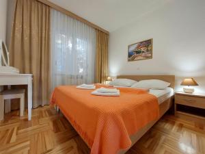 Postel nebo postele na pokoji v ubytování Apartments Zeljko