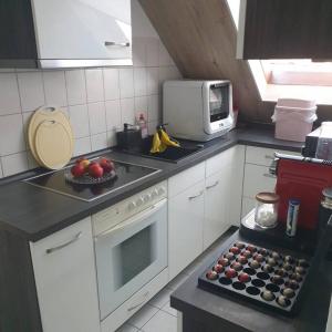 a kitchen with a counter top with fruit on it at Obere Dorfstraße in Wolfsburg