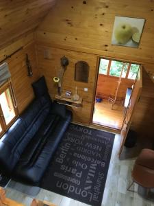 an overhead view of a living room with a couch at Brvnara Ruska sauna in Čajetina