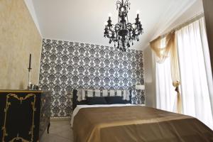 En eller flere senge i et værelse på Casavacanze Azzurro Mare