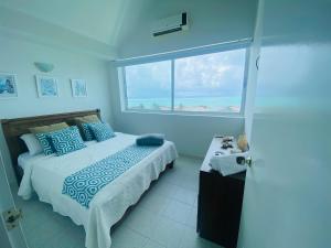 En eller flere senge i et værelse på San Andrés espectacular apto frente al mar, WI-FI + 44 billeder