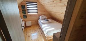 an overhead view of a bedroom in a log cabin at Leśne Zacisze in Łuka