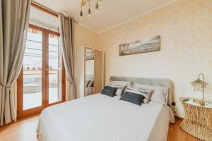 Ένα ή περισσότερα κρεβάτια σε δωμάτιο στο la terrazza nel centro