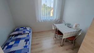 Postel nebo postele na pokoji v ubytování Pokoje Gościnne Odargowo