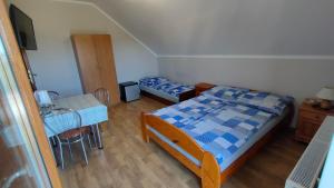 Postel nebo postele na pokoji v ubytování Pokoje Gościnne Odargowo