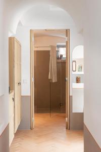a hallway with a door open to a bathroom at Masseria Auraterrae in Polignano a Mare