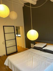 Łóżko lub łóżka w pokoju w obiekcie Maison moderne Avignon 6 pers