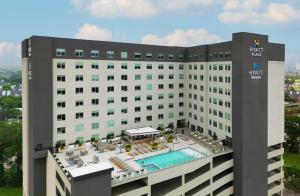 a view of a hotel with a swimming pool at Hyatt House Houston Medical Center in Houston