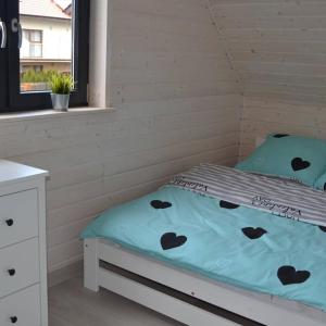 Voodi või voodid majutusasutuse Domki I apartamenty Mila toas