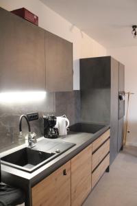 a kitchen with a sink and a counter at Mediterranean Vista in Dubrovnik