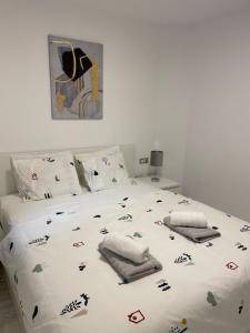 Кровать или кровати в номере Jardines Apartment