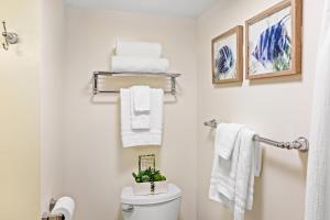 a bathroom with white towels and a toilet at Napili Shores F150 in Napili-Honokowai +18 photos