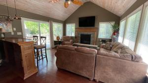 a living room with a couch and a fireplace at Great Escape in New Buffalo