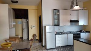 Kuchyň nebo kuchyňský kout v ubytování Residence Il Cantiere