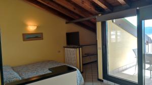 Postel nebo postele na pokoji v ubytování Residence Il Cantiere