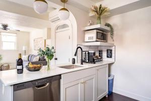 a kitchen with a sink and a counter top at Lady Madonna Sage Flat in Salt Lake City